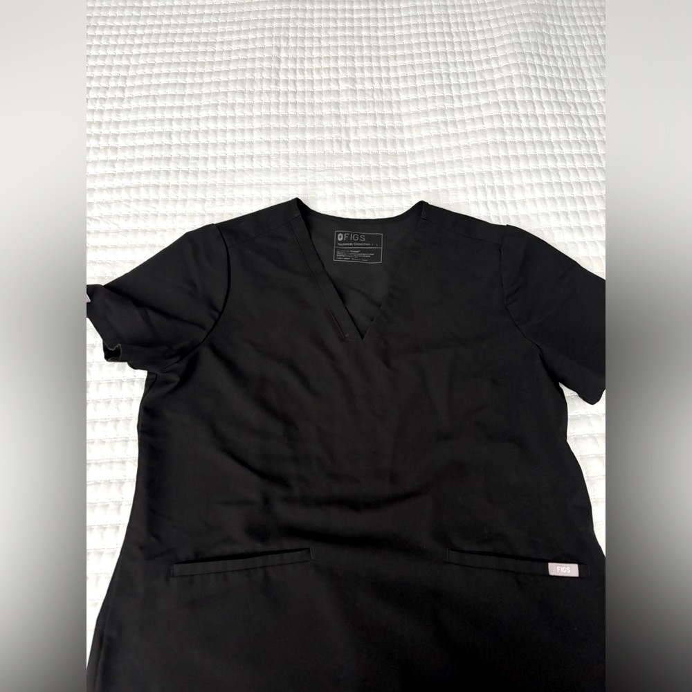 Figs scrub top. Used condition. Small discoloration on side, see photos.